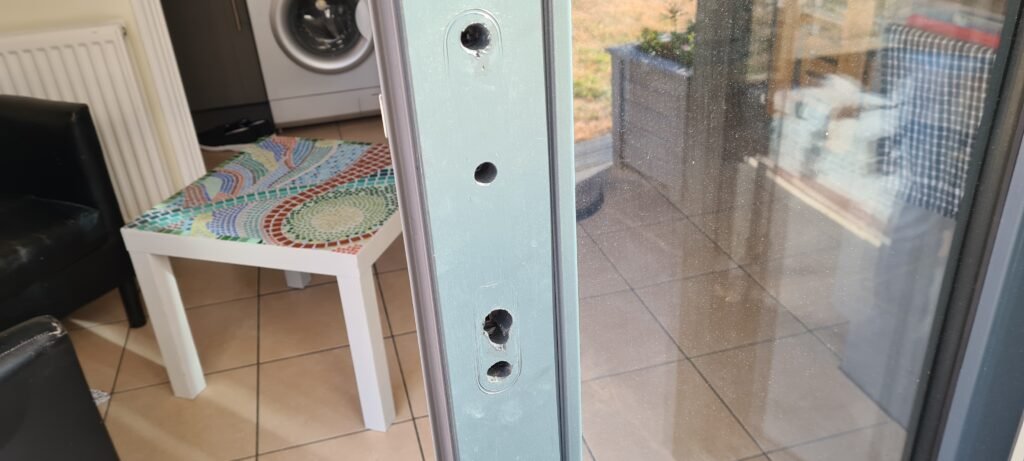 Holes drilled in third door for the handle