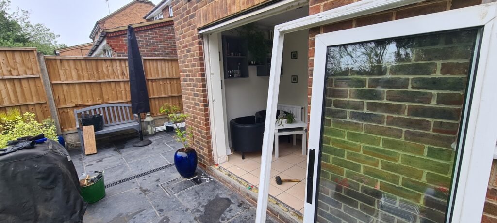 Old patio sliding doors removed from frame