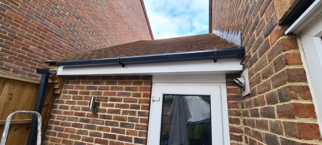 New gutter brackets fixed in place with the new anthracite guttering attached