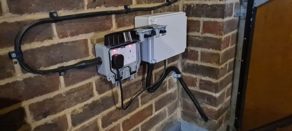 Armoured supply cable into weatherproof socket box where LED driver is plugged in