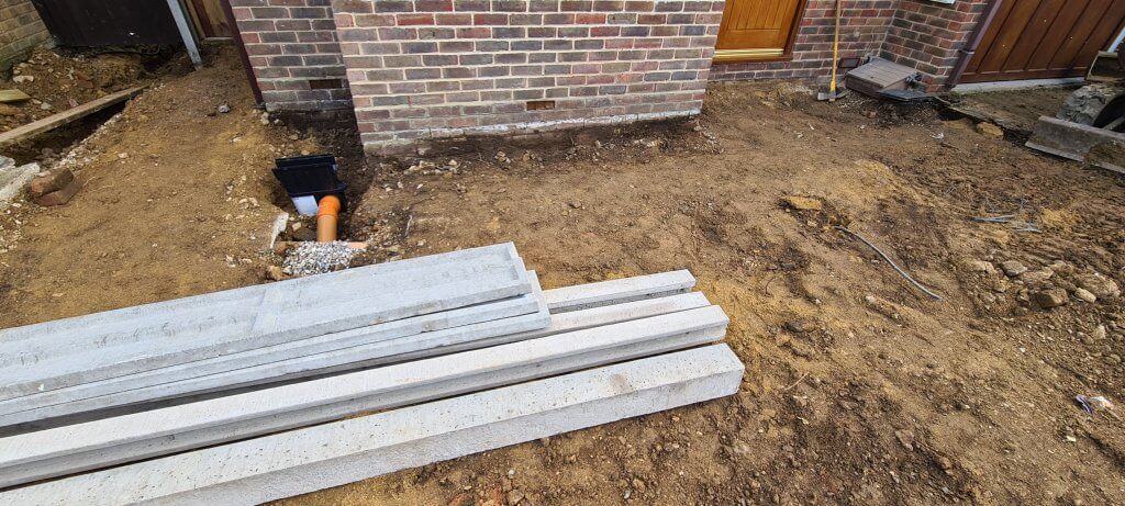Concrete fence posts and gravel boards