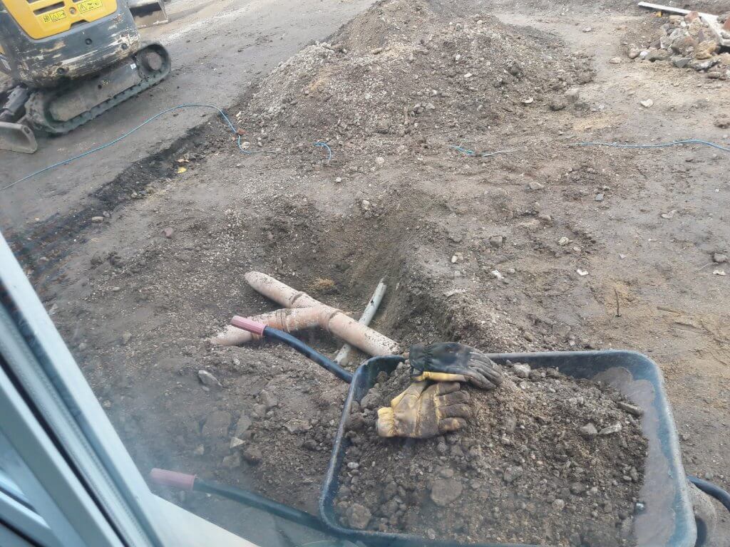 Digging out the main sewer line