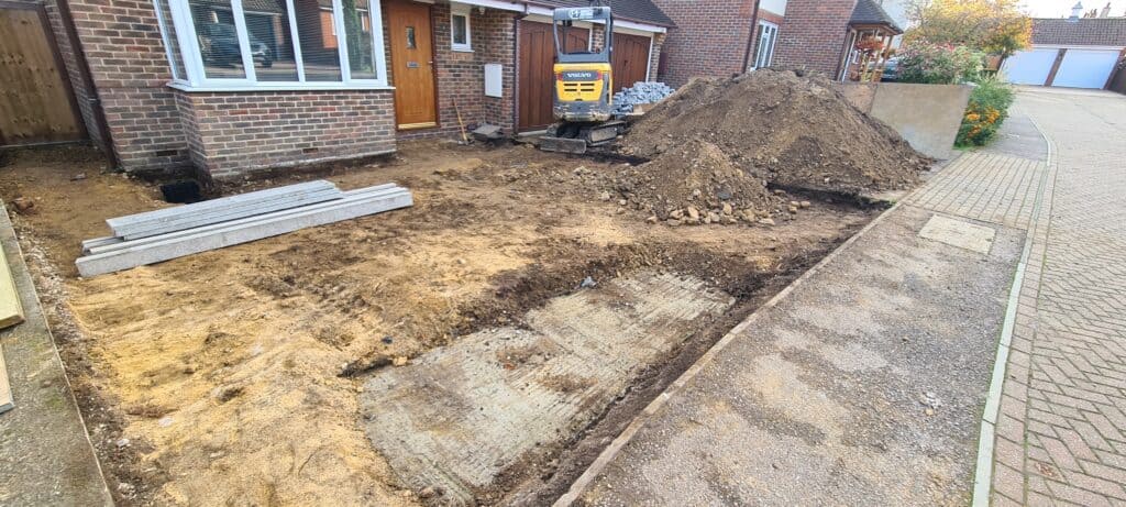Site after soak away pit construction and infill with concrete fence posts and gravel boards ready to be installed