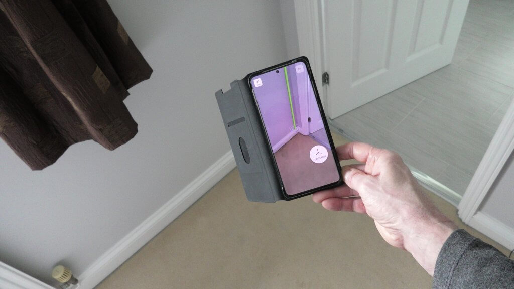 A room scanner and planning app being used on a Samsung S205g smartphone