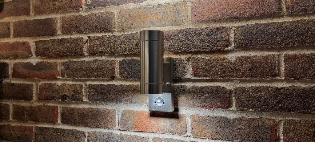 Outdoor up and down wall light in stainless steel with warm white led bulb